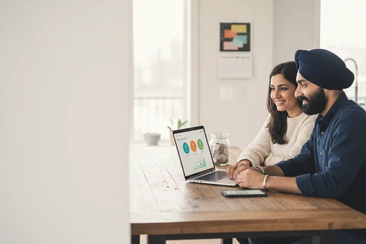 Sikh couple reviewing tax-free investments